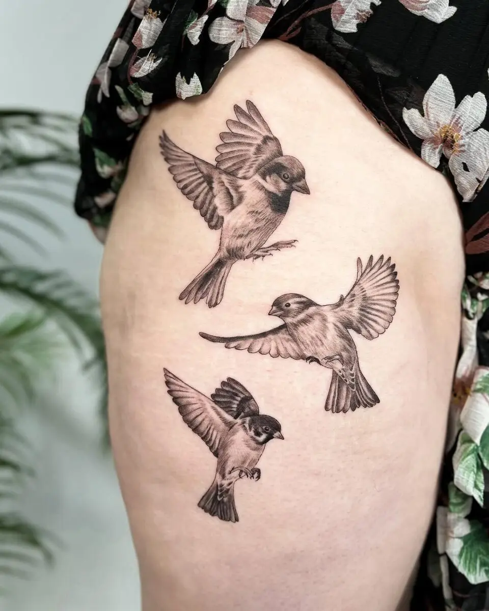 Elegant sparrow tattoo trio in flight