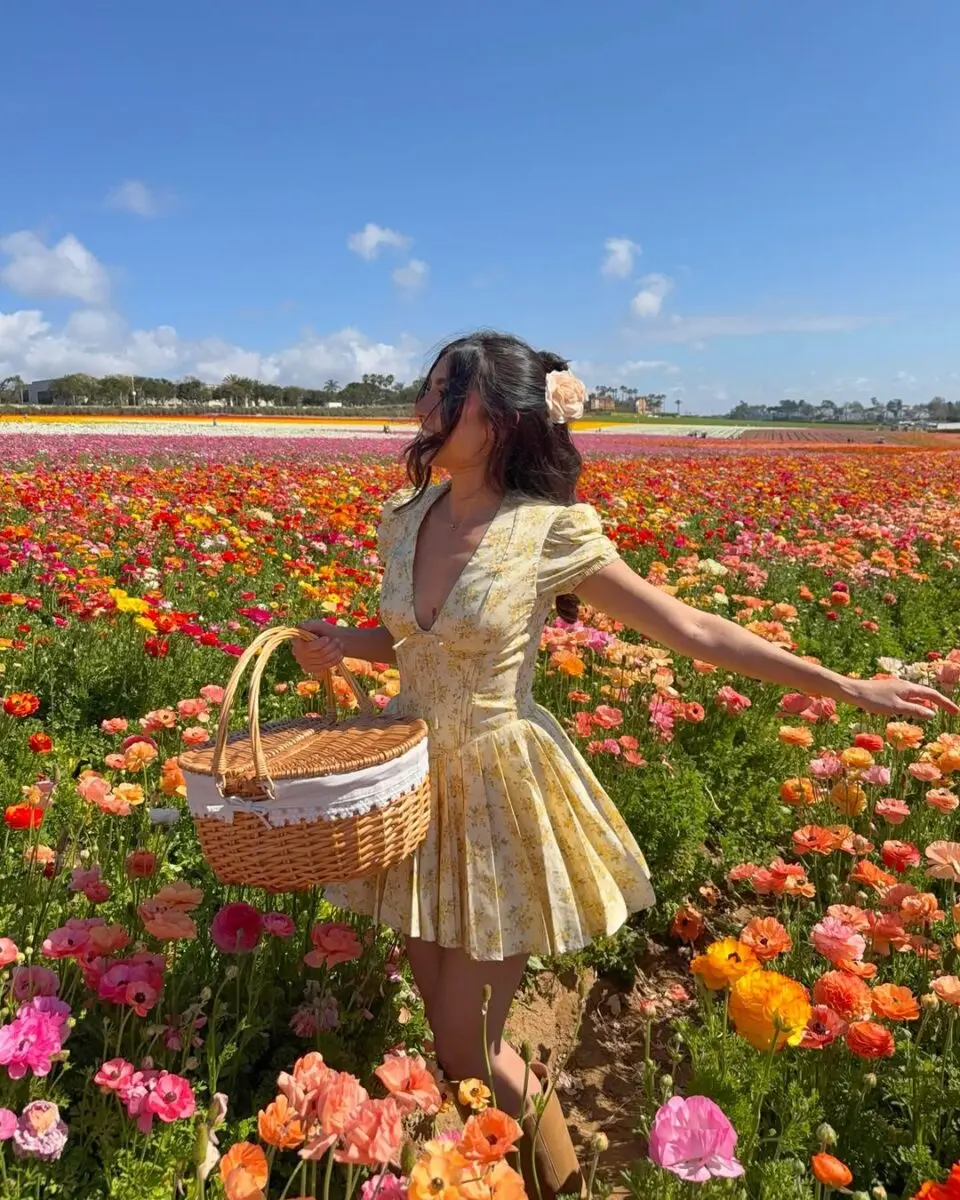 Charming yellow spring dress in flower fields