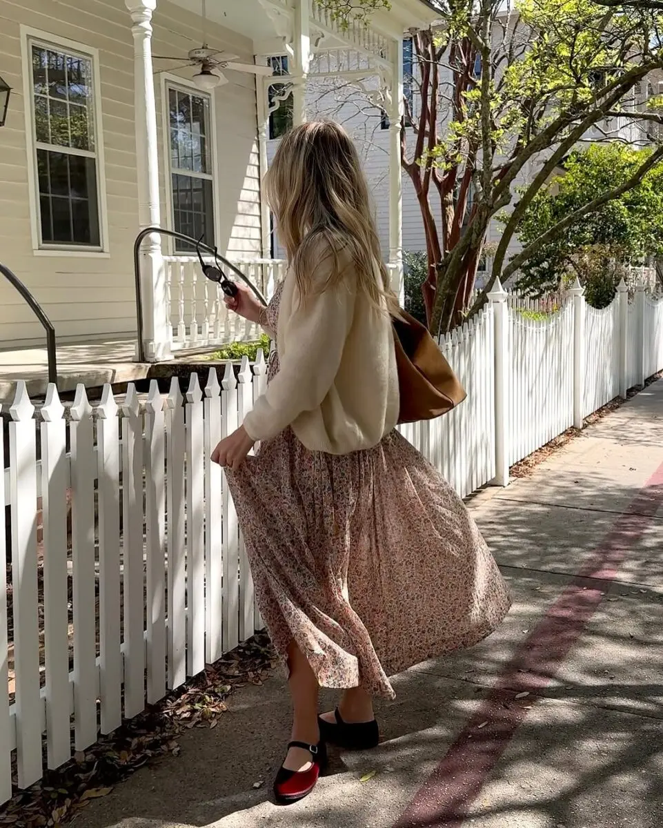 Effortless floral dress paired with a cozy sweater