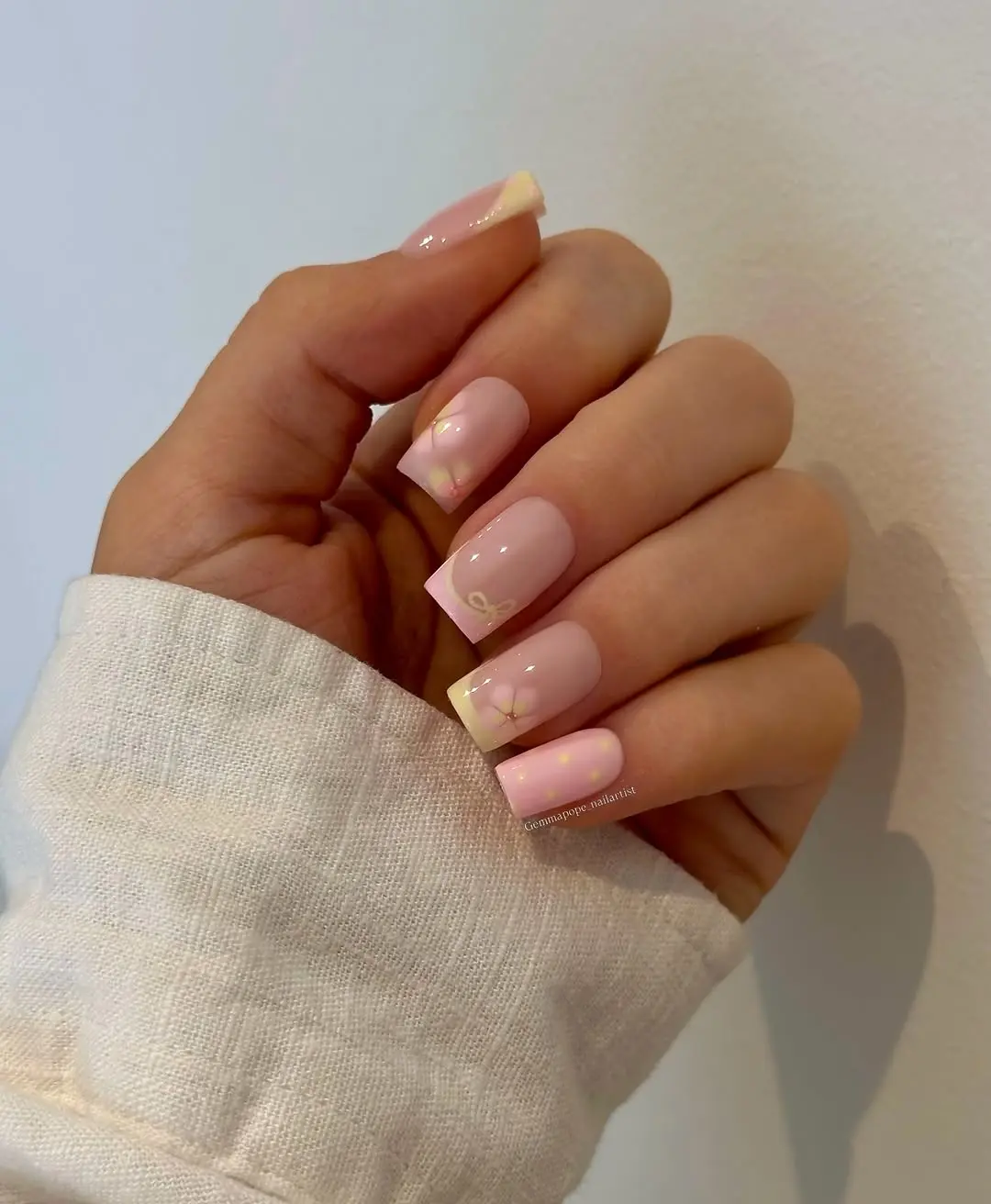 Charming pastel square nails with floral accents