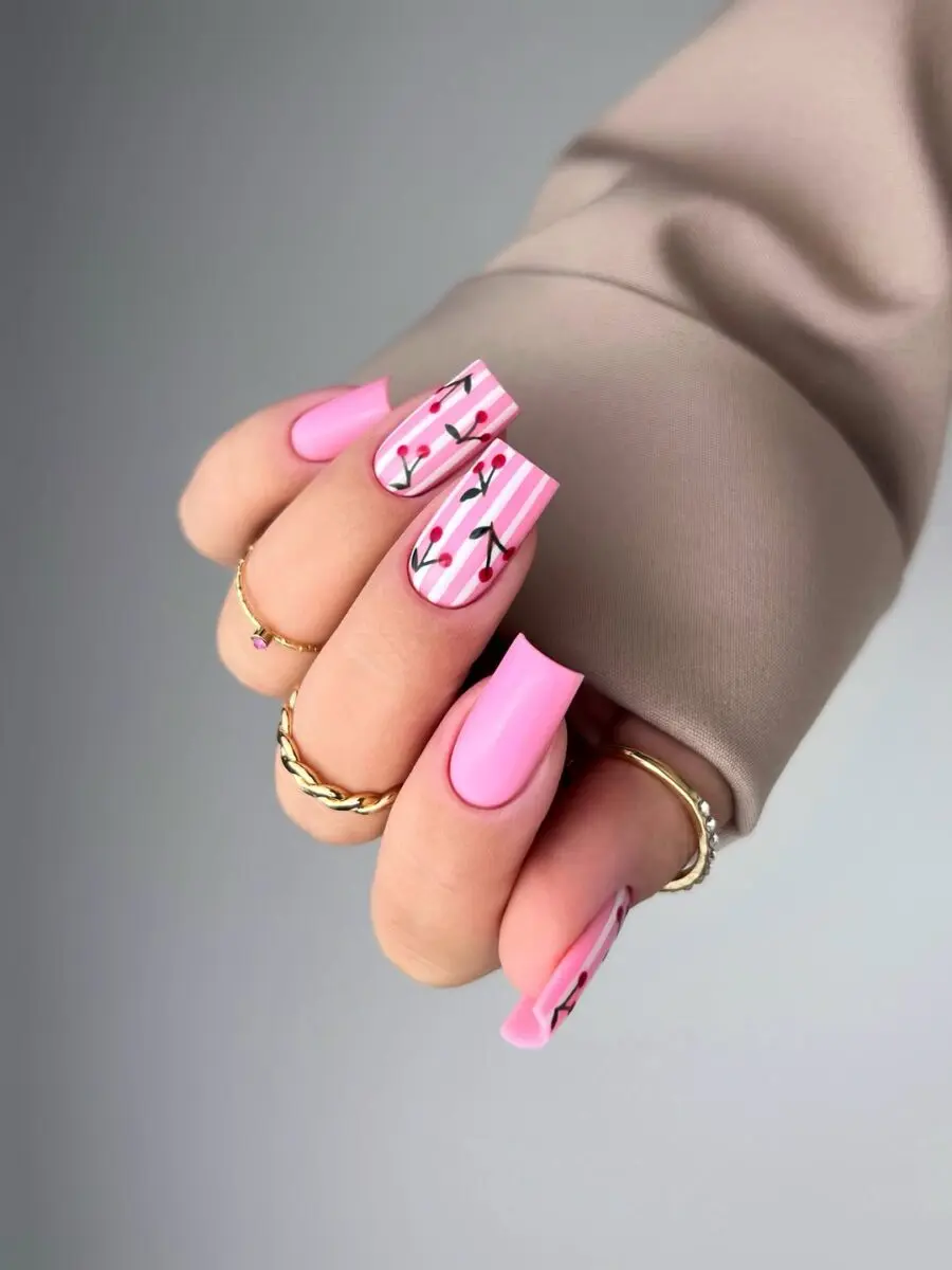 Vibrant pink square nails with cherry blossoms