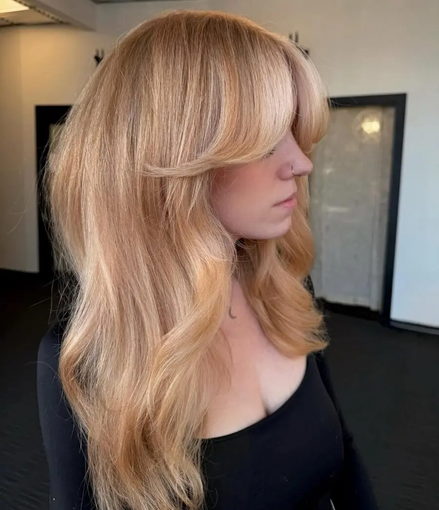 Elegant strawberry blonde with soft waves