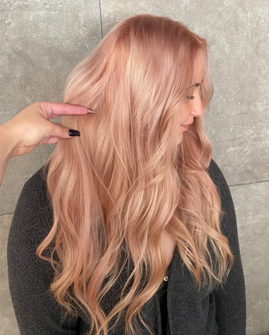 Elegant long wavy strawberry blonde hairstyle