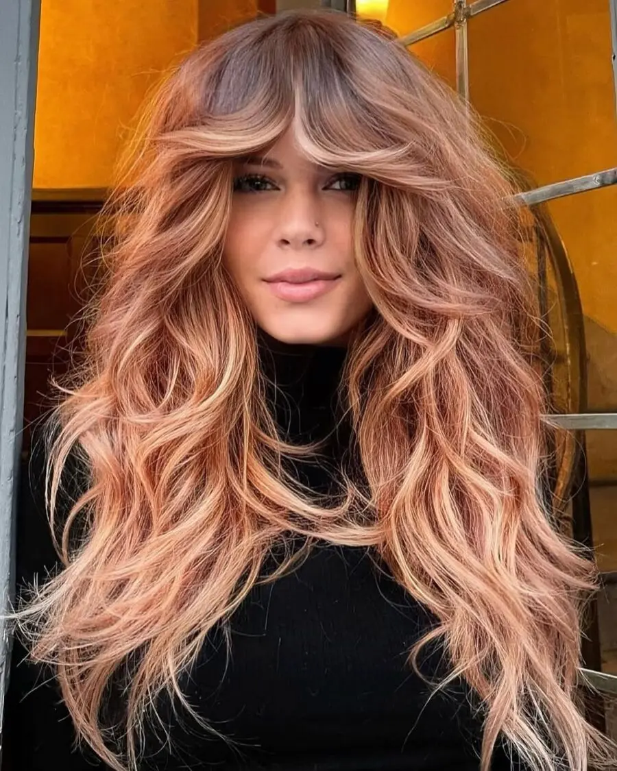 Beautifully layered strawberry blonde hairstyle