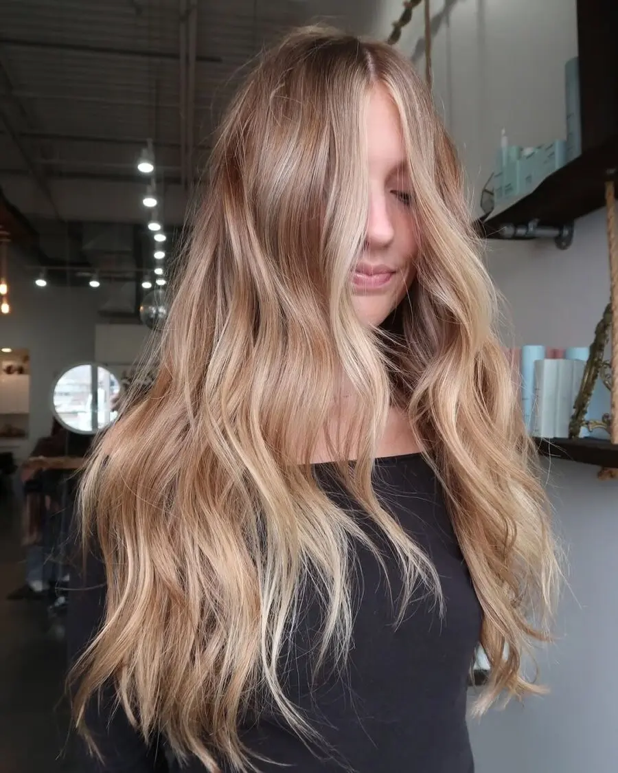 Elegant wavy strawberry blonde hairstyle for any occasion