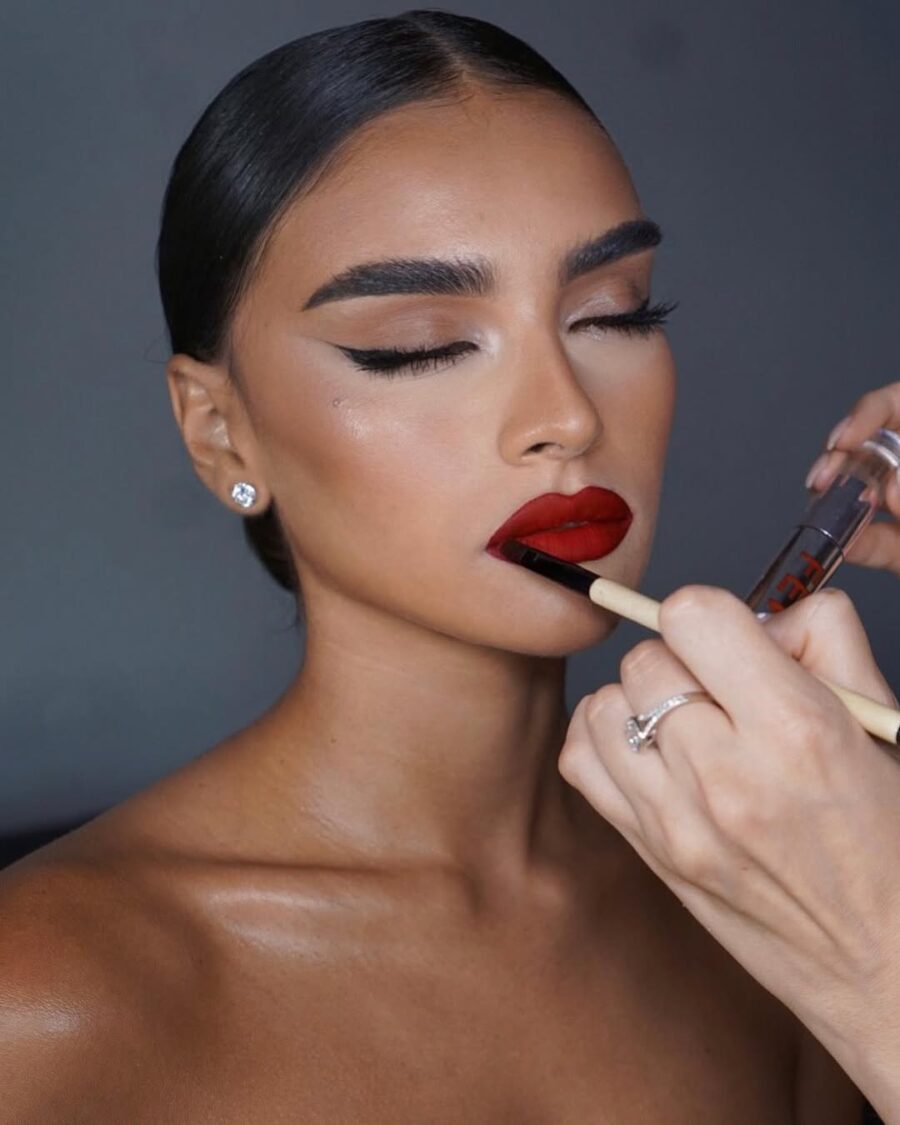 Glamorous red lipstick and sleek eyeliner look