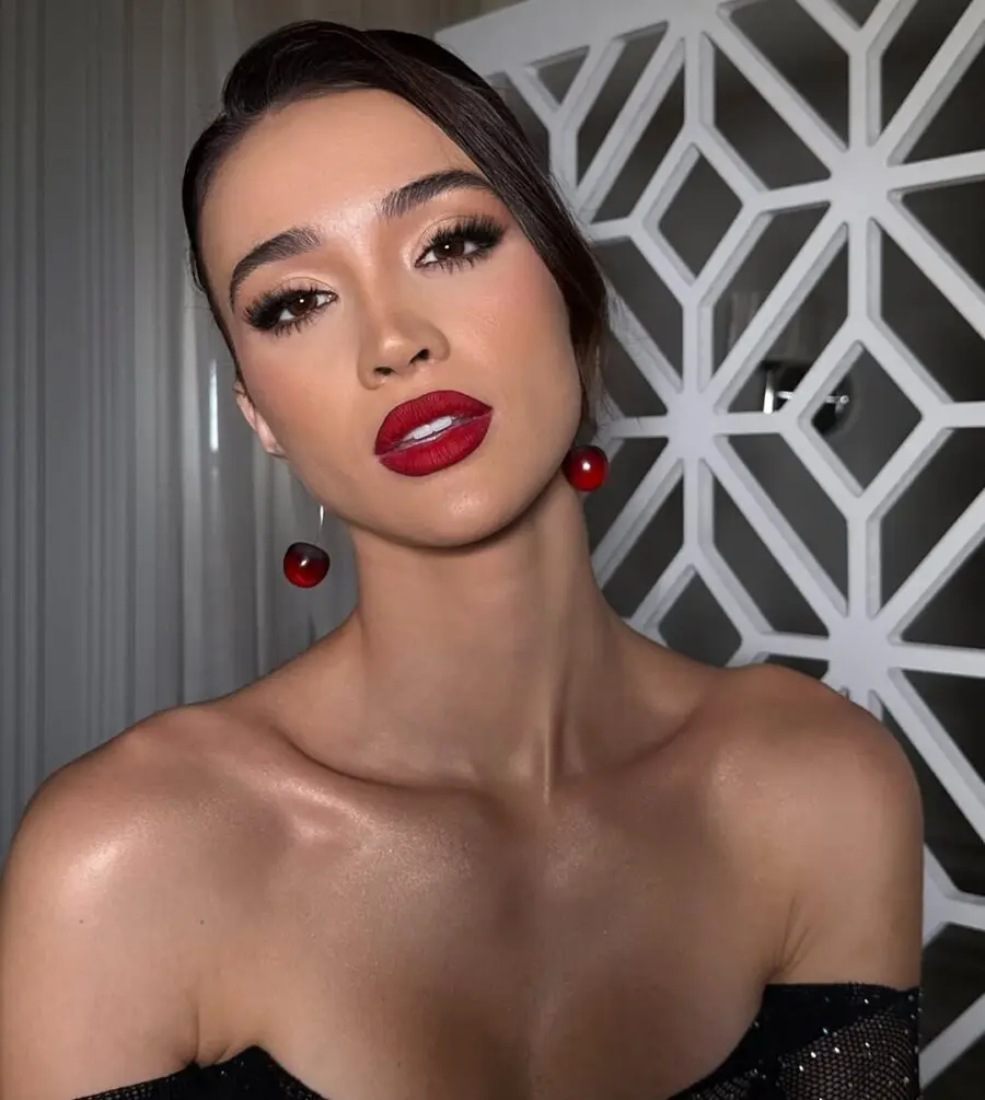 Bold red lips elevate glamorous makeup look