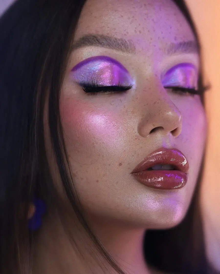 Vibrant purple hues with glossy lips