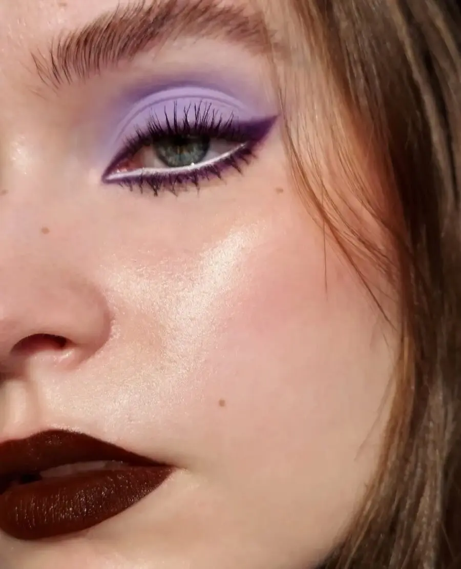 Bold lilac eyes and deep brown lips