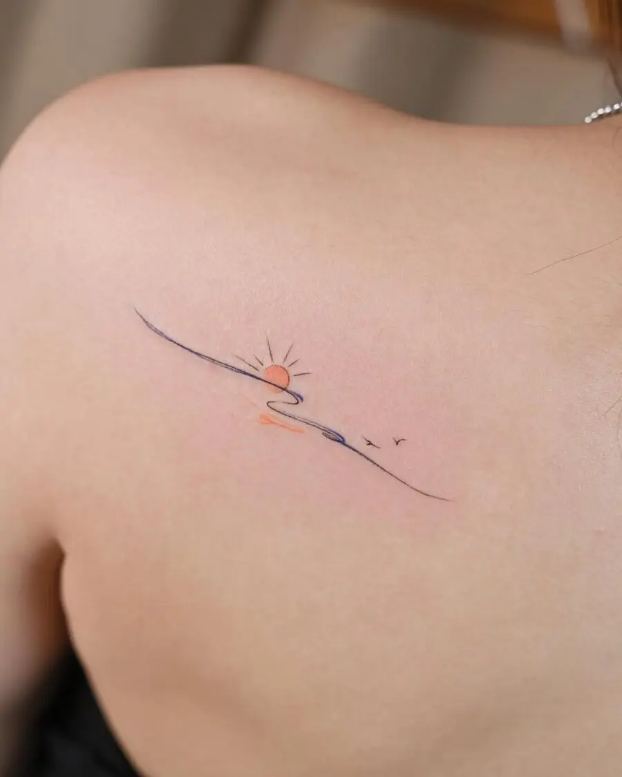 Minimalist sunset tattoo representing tranquility