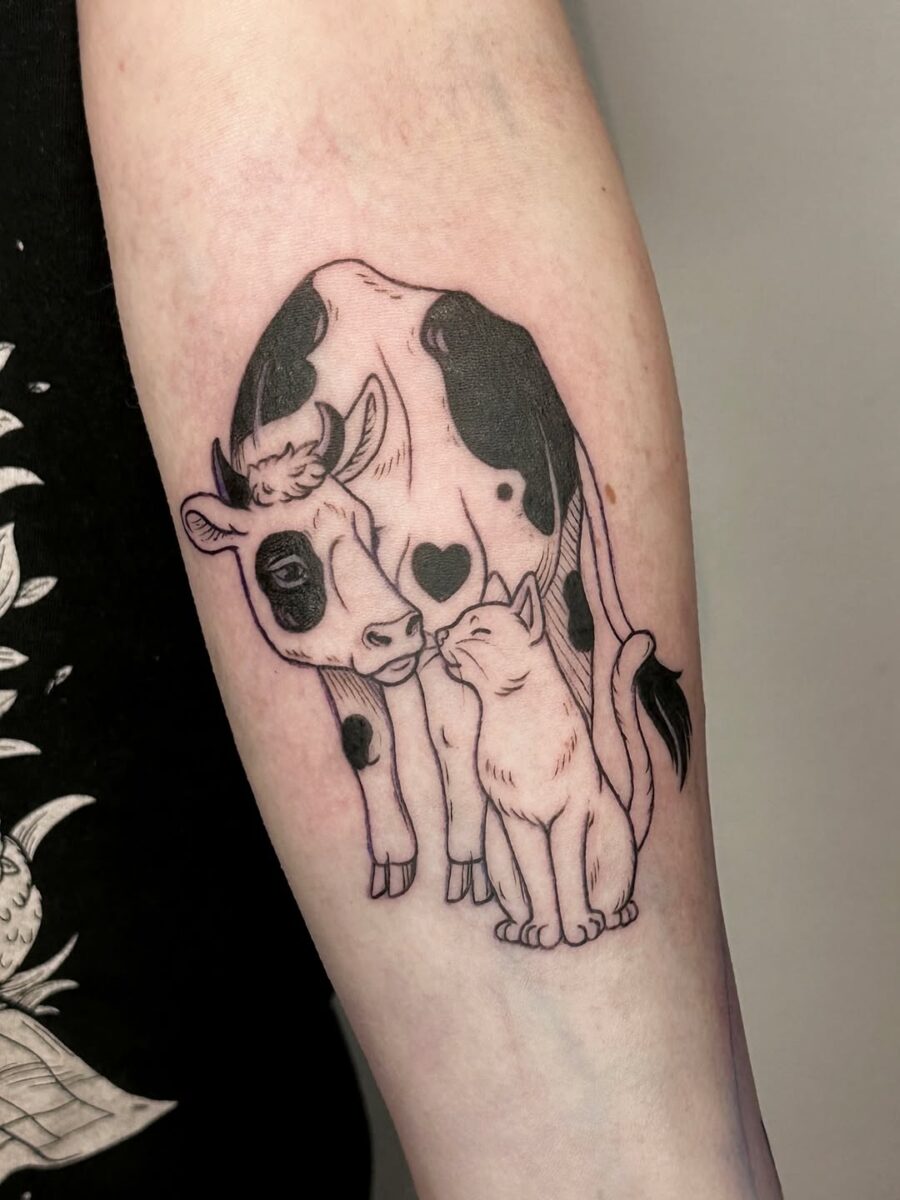 Whimsical cow and cat tattoo design