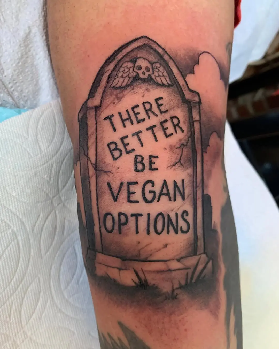 Humorous vegan-themed grave stone tattoo design