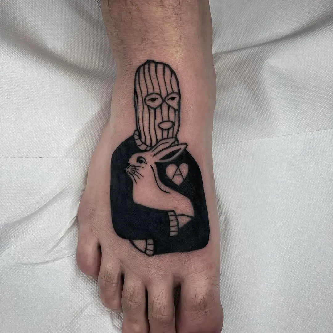 Unique vegan-themed foot tattoo design