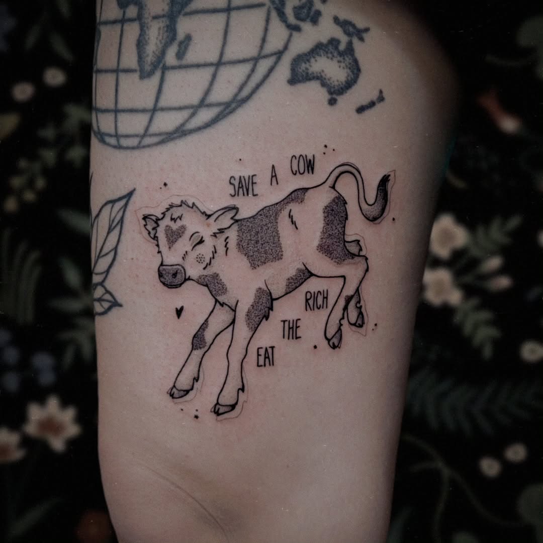 Whimsical calf tattoo with a vegan message