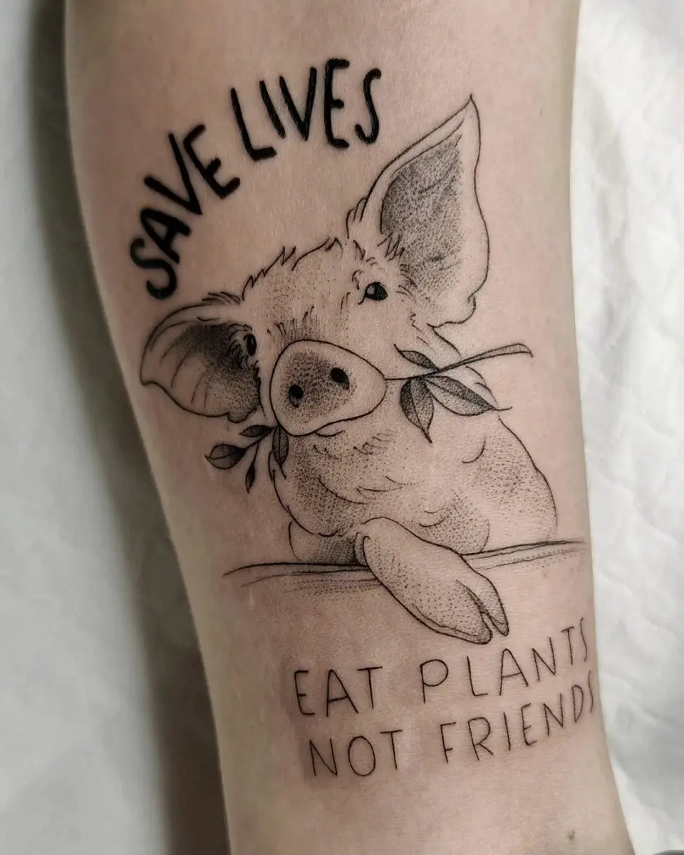 A heartwarming vegan tattoo featuring a pig