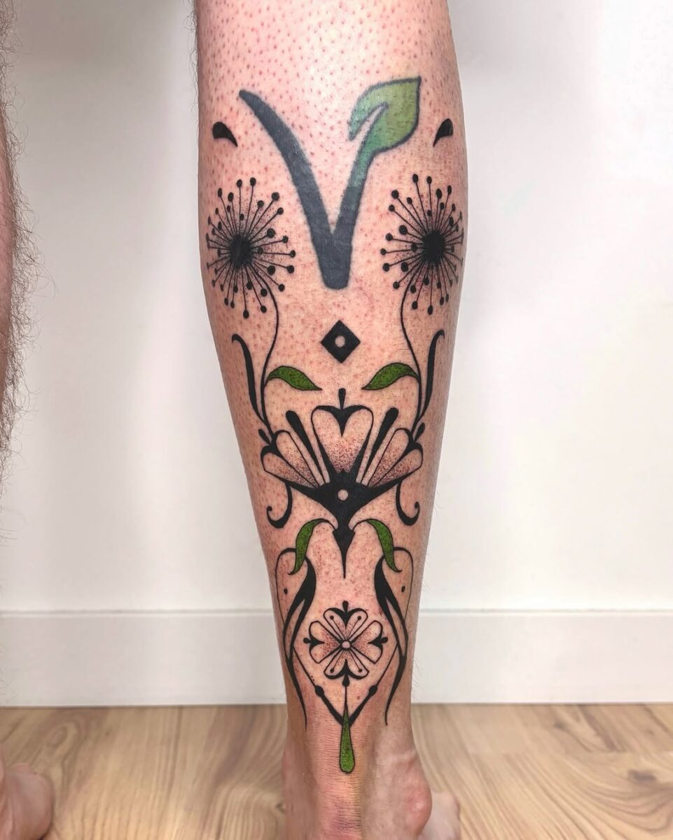 Elegant vegan tattoo with floral motifs