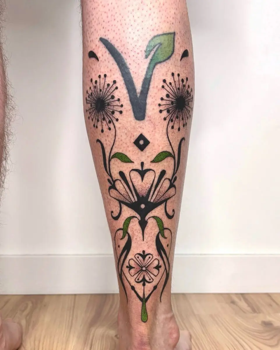 Elegant vegan tattoo with floral motifs