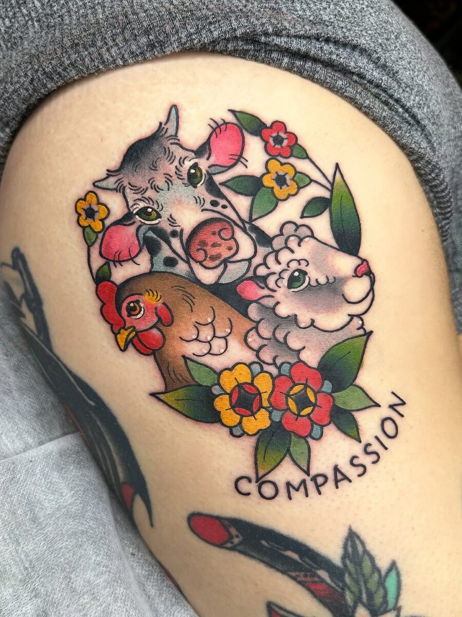 Whimsical compassion-themed vegan animal tattoo