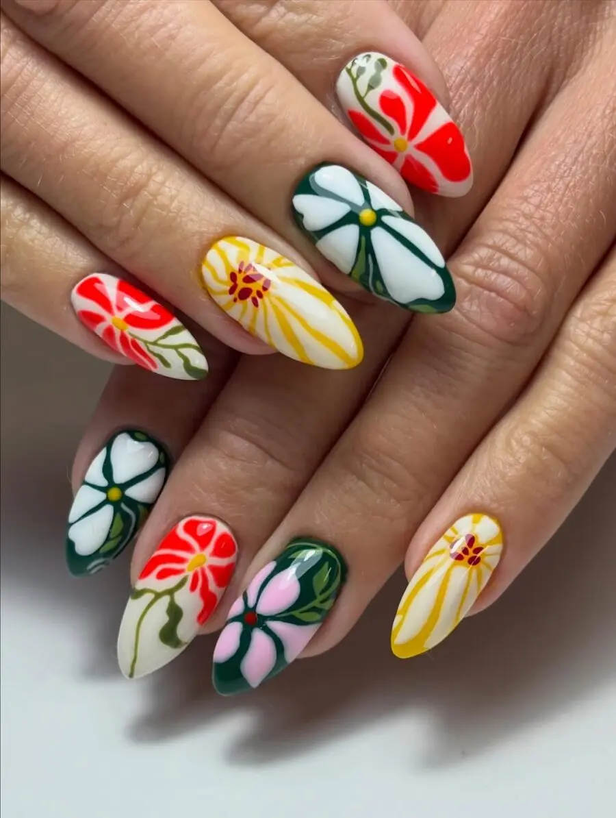 Playful floral accents on stunning almond nails