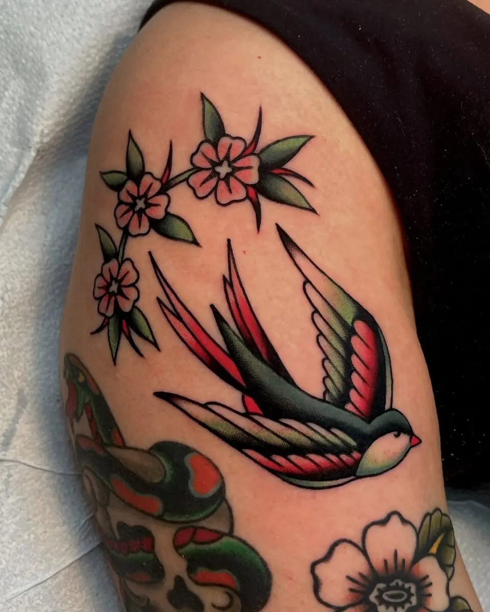 Vibrant Sparrow Tattoo with Delicate Flowers