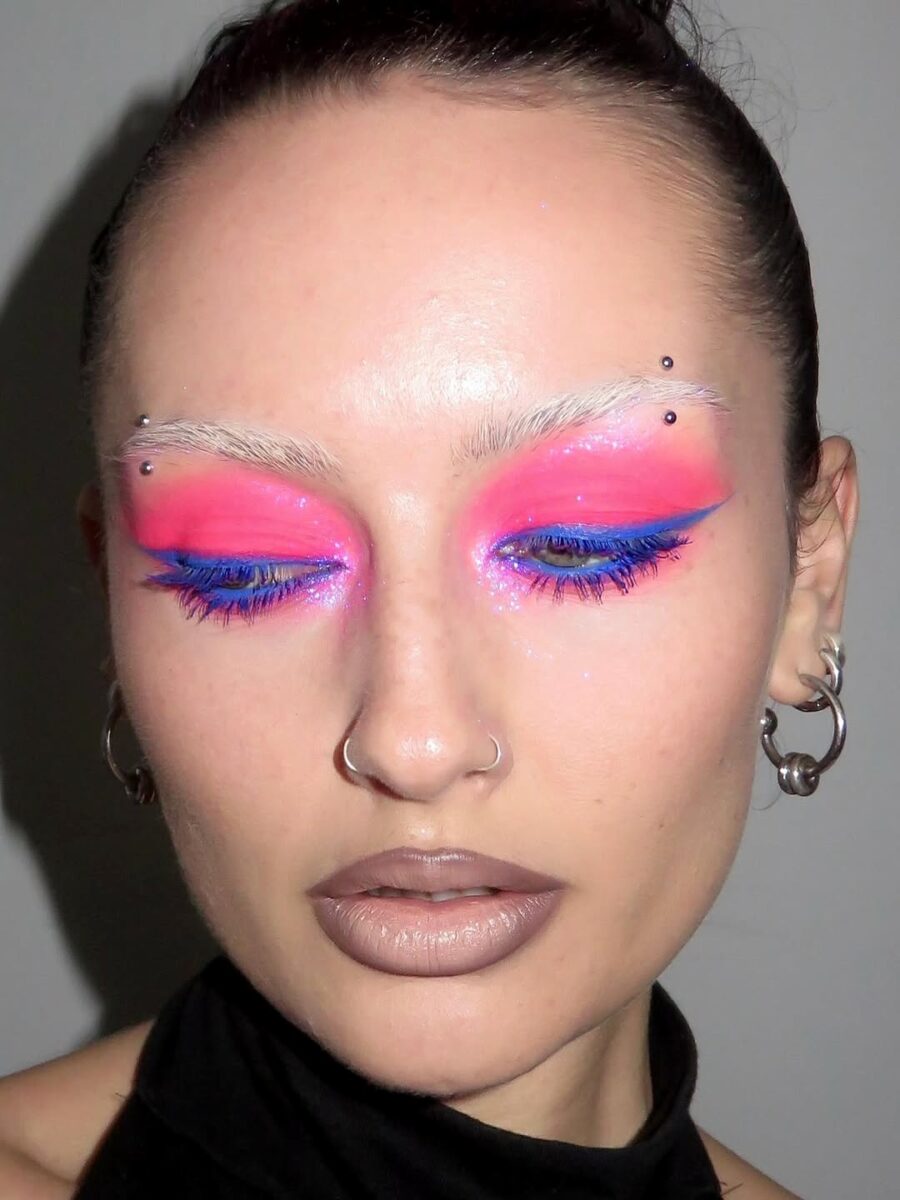 Bold pink eyeshadow with striking blue accents