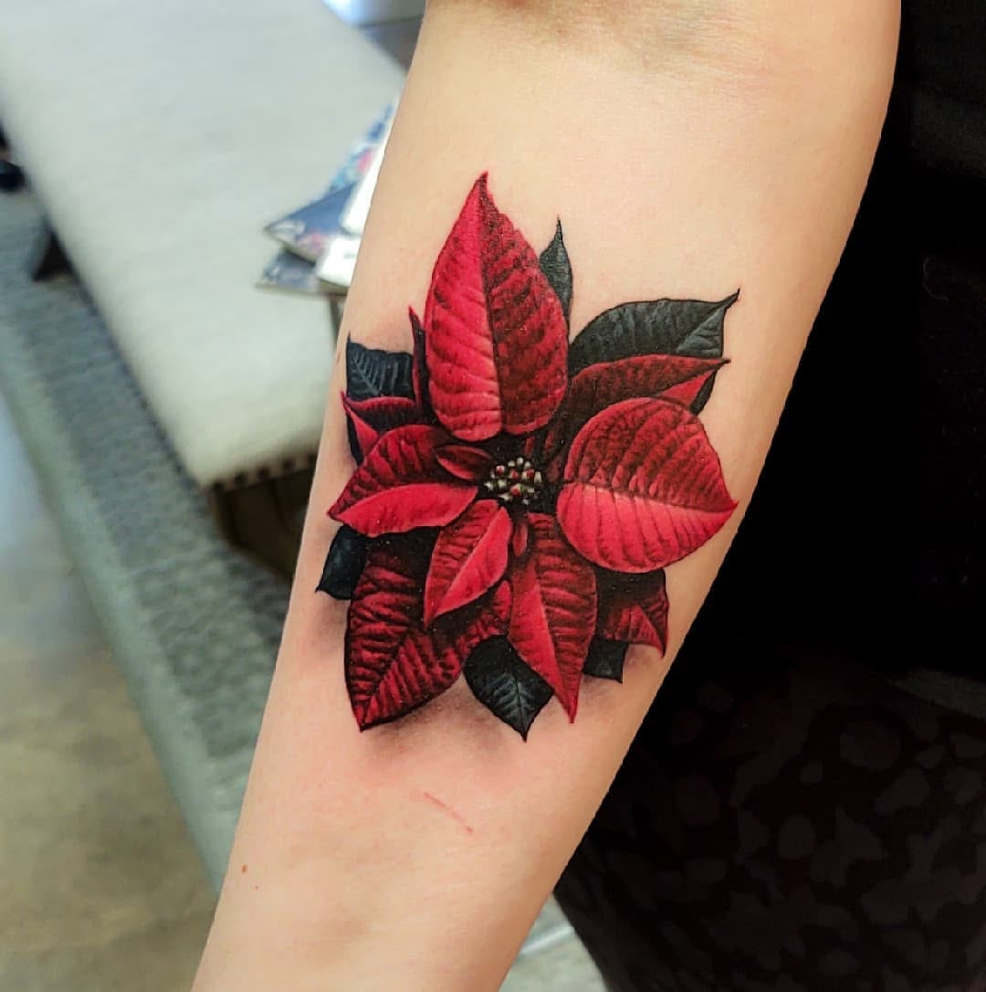 Beautiful and bold poinsettia tattoo design