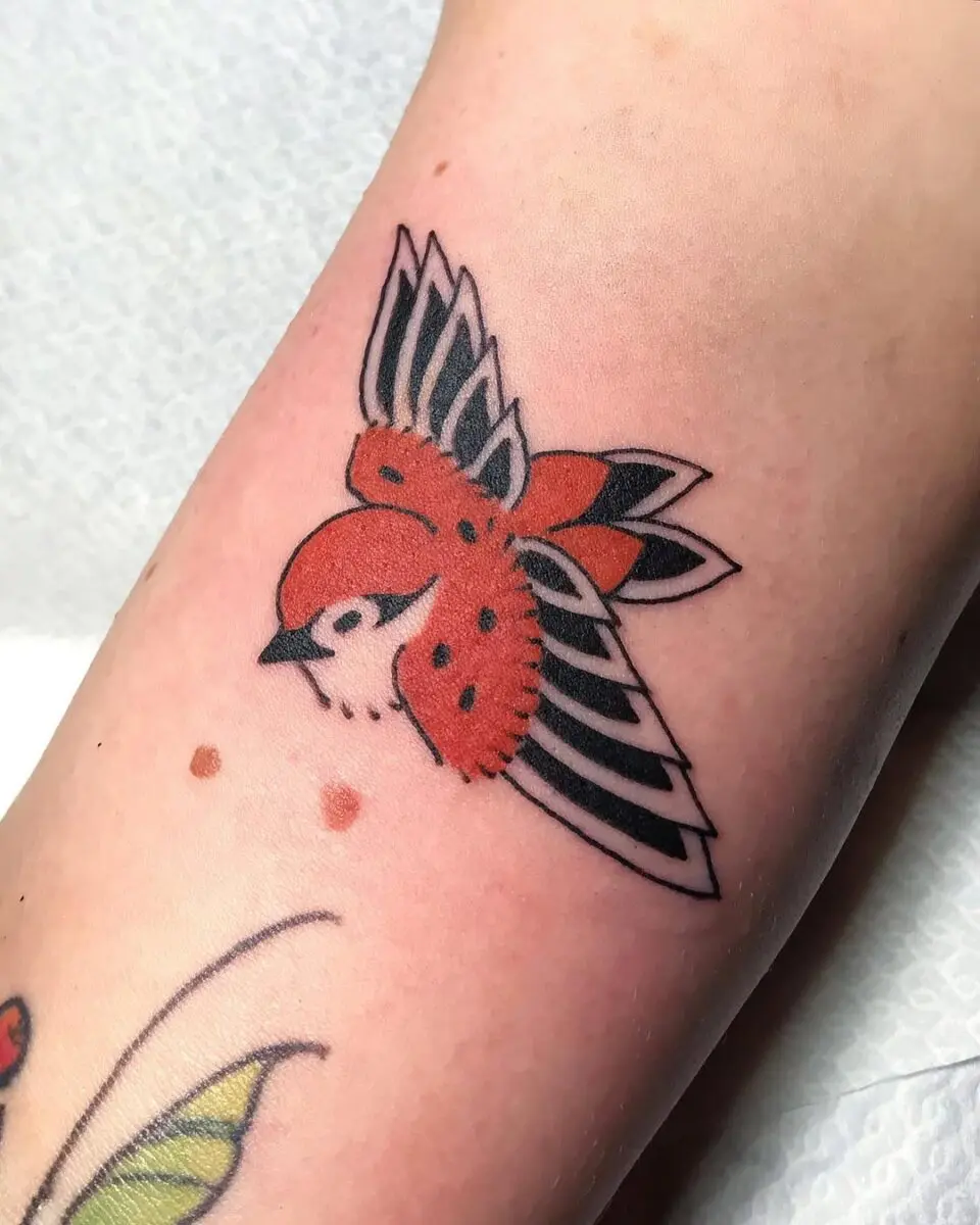 Bold and vibrant sparrow tattoo design