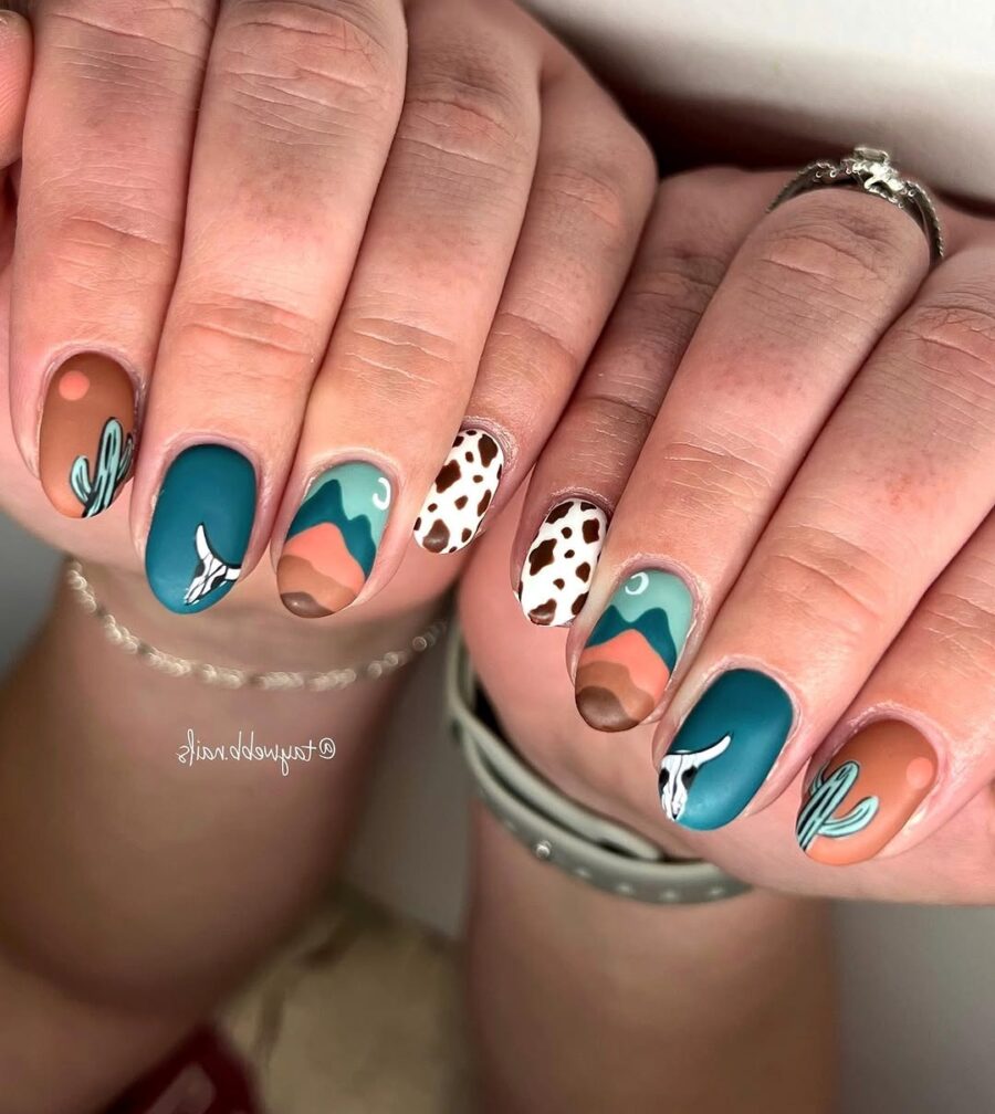 Colorful western-themed nails with desert vibes