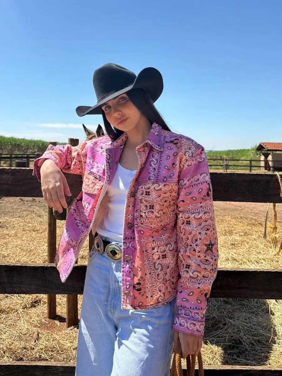 Stylish Cowgirl in Vibrant Pink Jacket