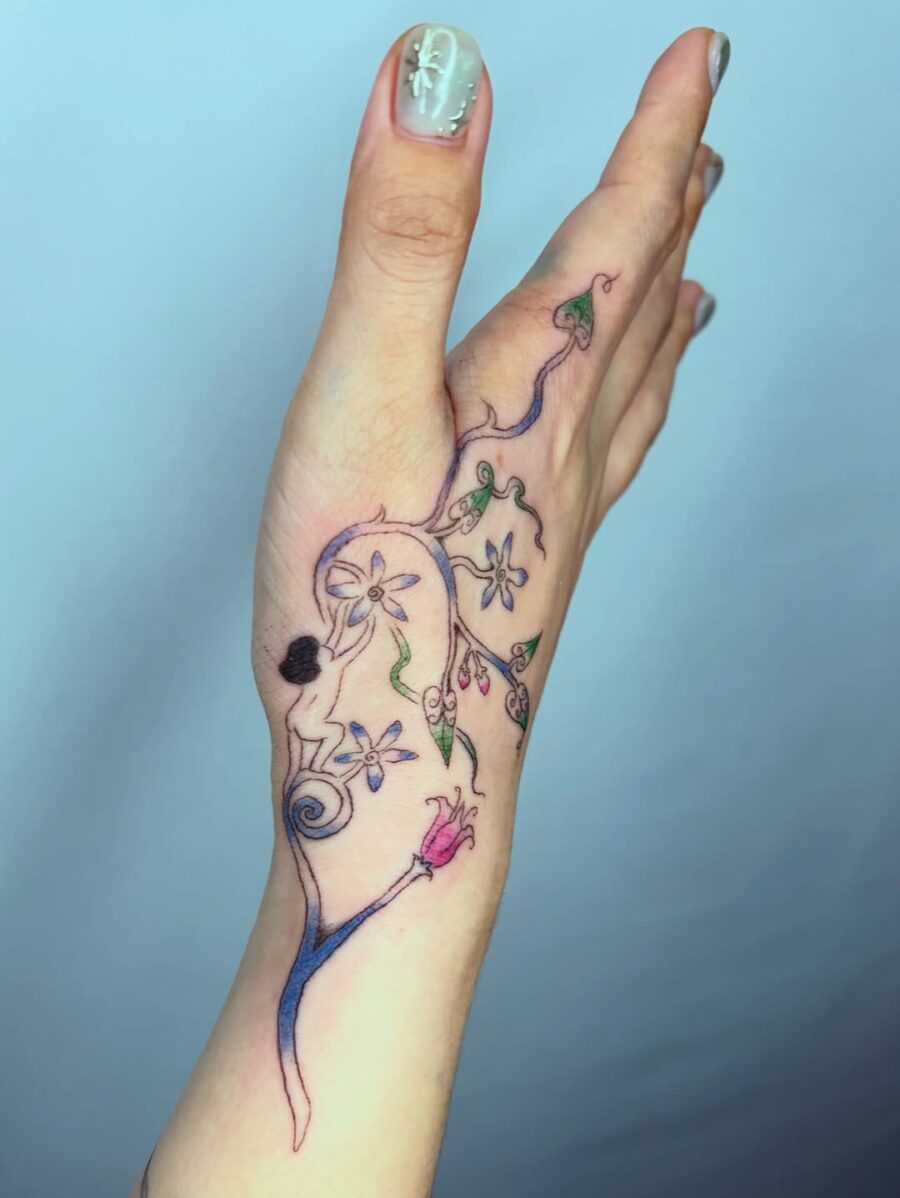 Unique floral side hand tattoo design