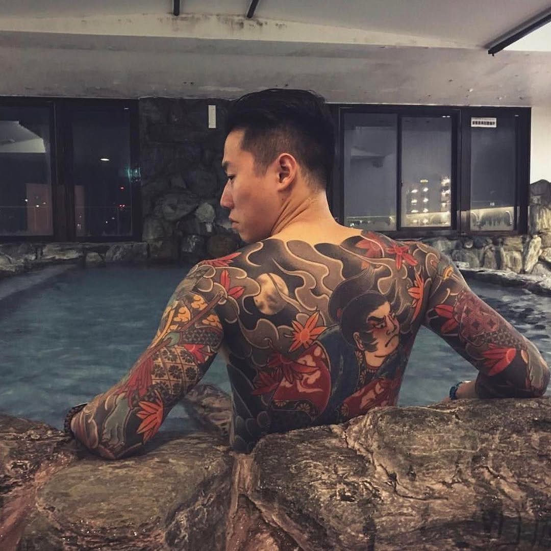 Stunning Back Tattoo Featuring Traditional Japanese Motifs