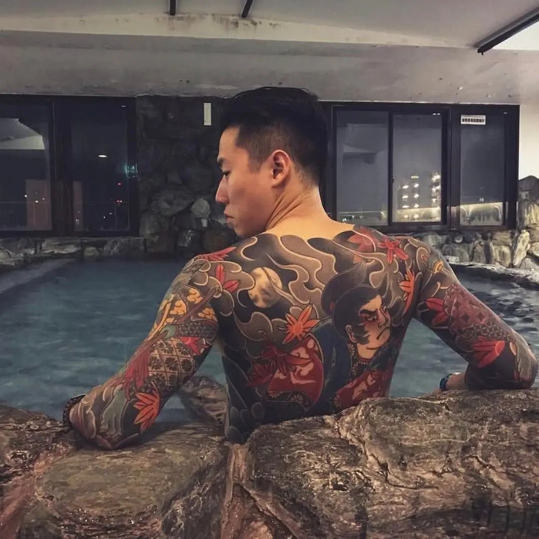 Stunning Back Tattoo Featuring Traditional Japanese Motifs