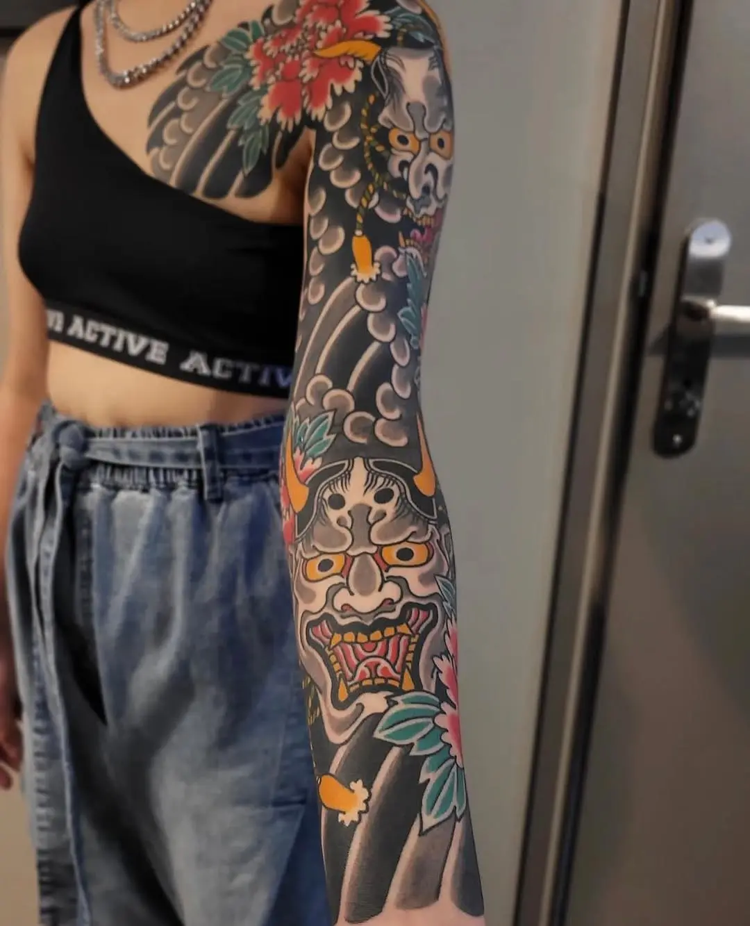 Intricate Yakuza Sleeve Tattoo with Bold Colors