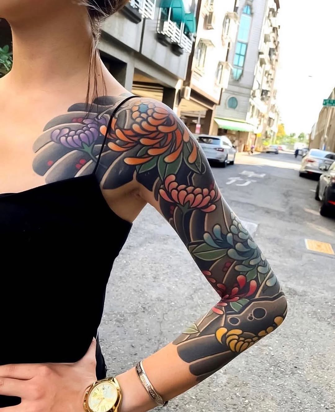 Colorful Yakuza Sleeve Tattoo in Urban Setting