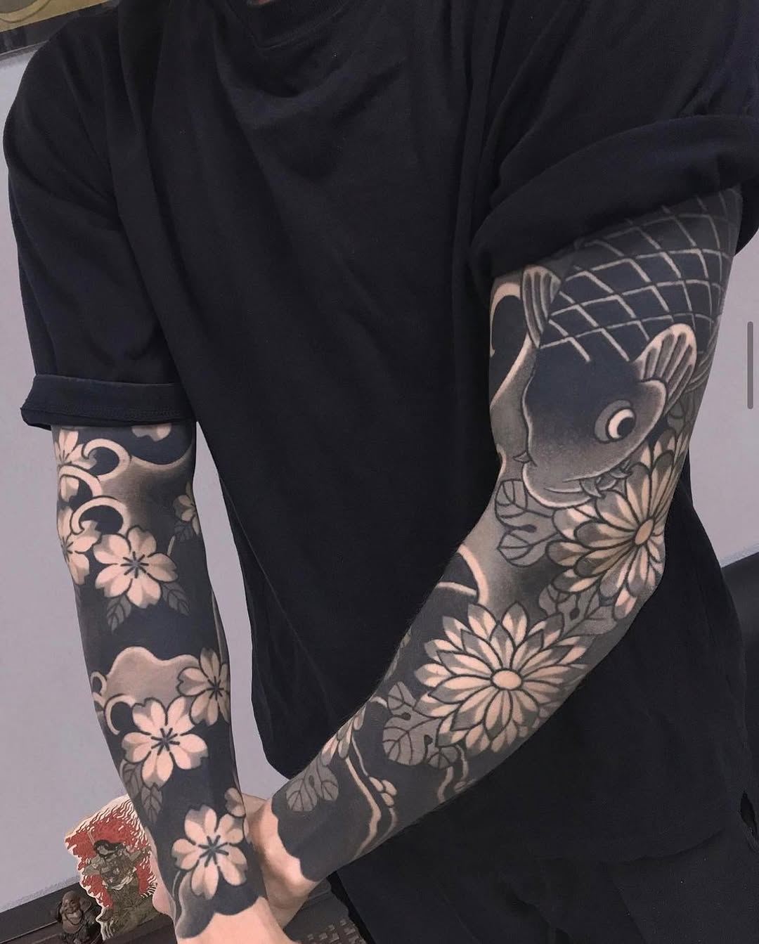 Intricate Yakuza Tattoos Featuring Koi and Flowers