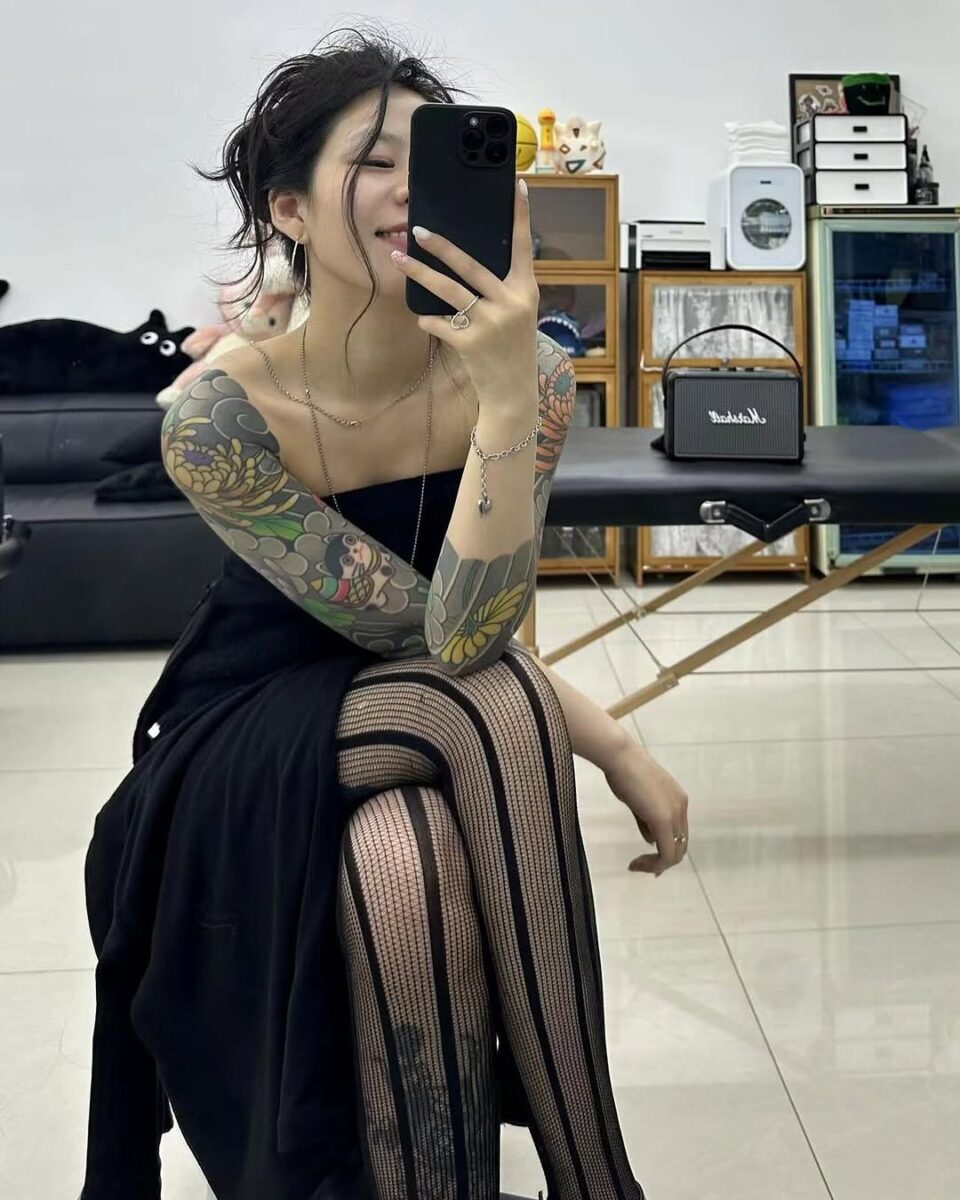 Vibrant Yakuza Tattoos on a Female Model