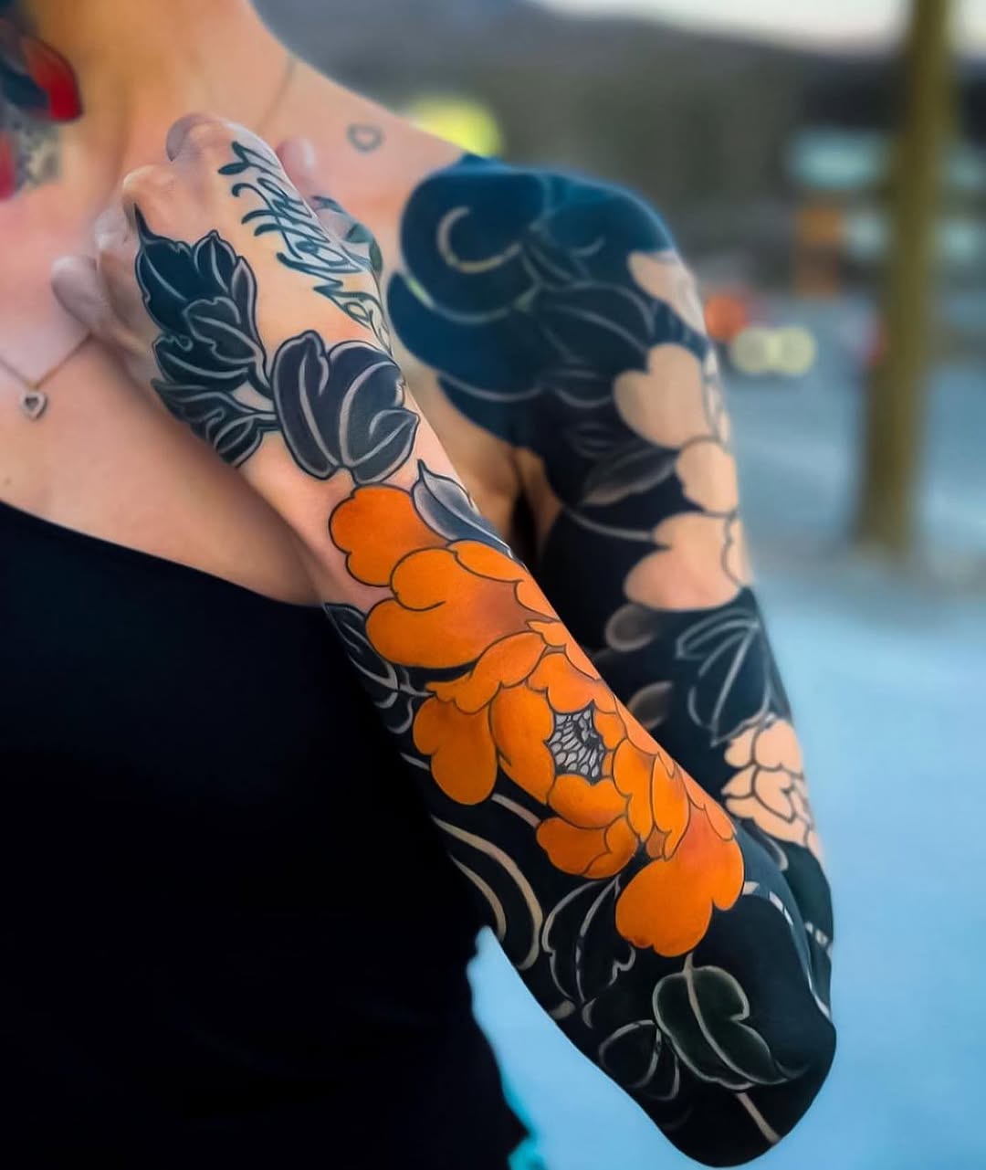 Stunning Orange Flower Against Dark Florals