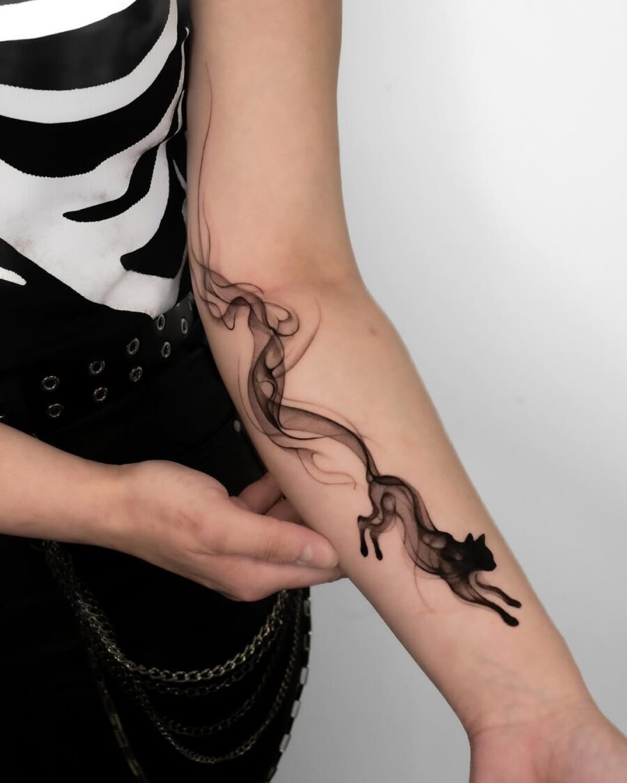 Elegant flow of a minimalist cat tattoo