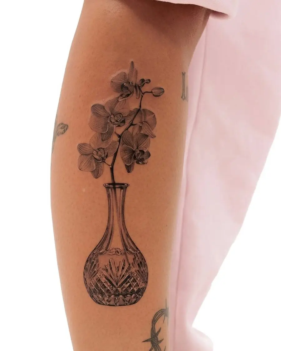 Elegant floral vase tattoo with delicate details