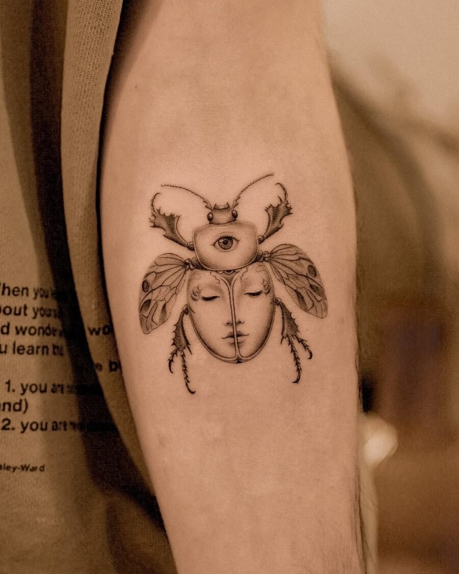 Mysterious insect-themed tattoo with artistic flair