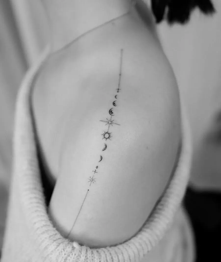 Celestial-inspired tattoo featuring moon phases