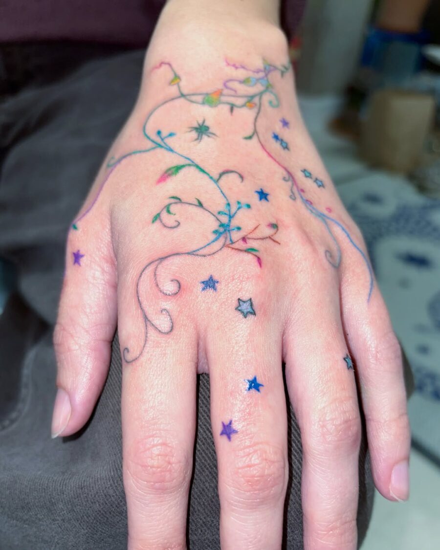 Colorful stars dancing across the hand