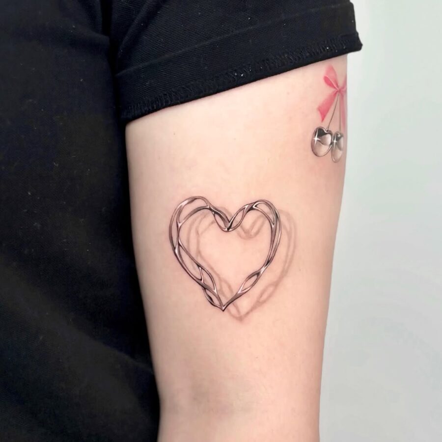 Unique wired heart tattoo with playful elements