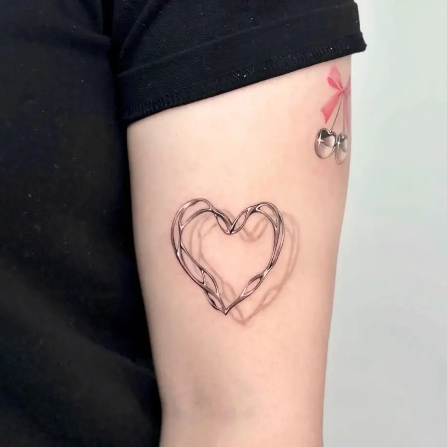 Unique wired heart tattoo with playful elements