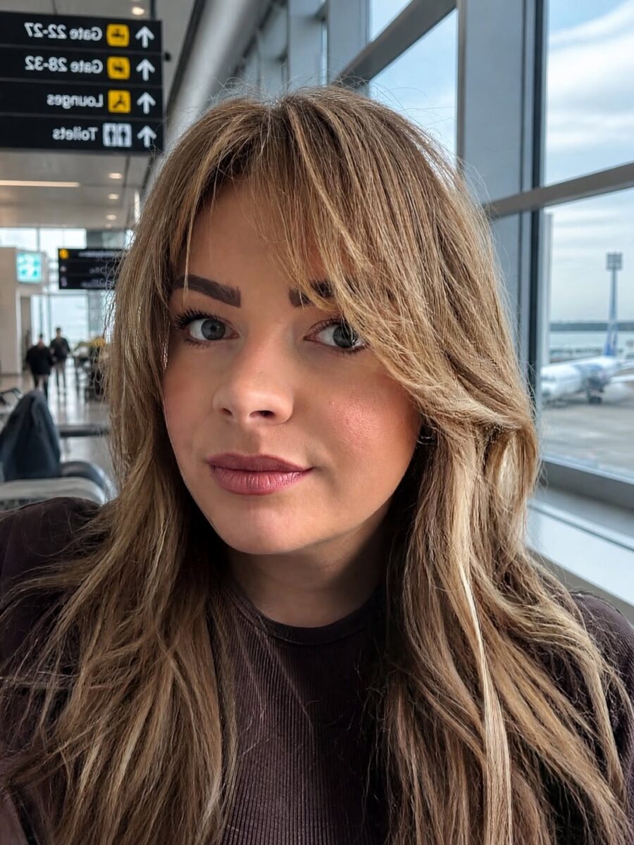 Effortlessly chic long bangs for jet-setters