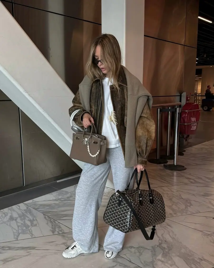 Chic airport hairstyle complementing stylish outfit