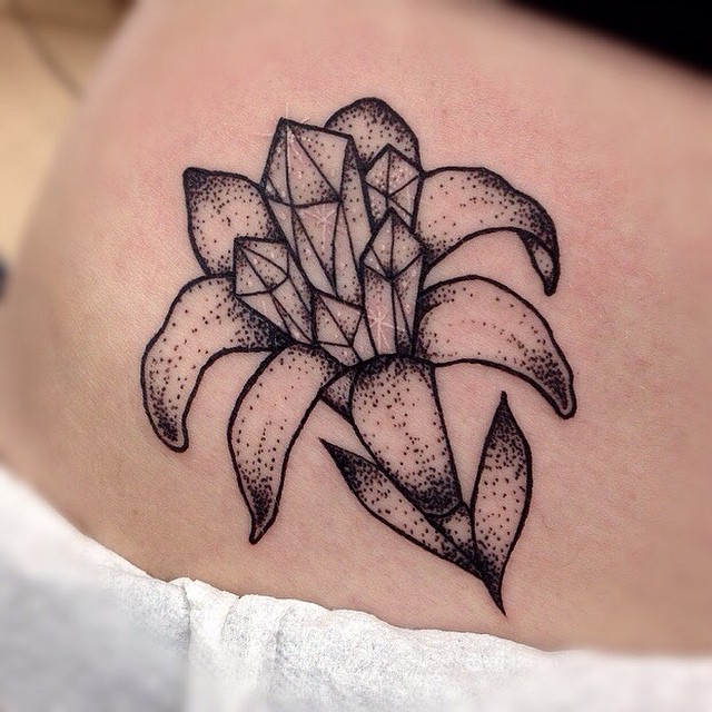Stylish Amaryllis Tattoo with Geometric Crystals