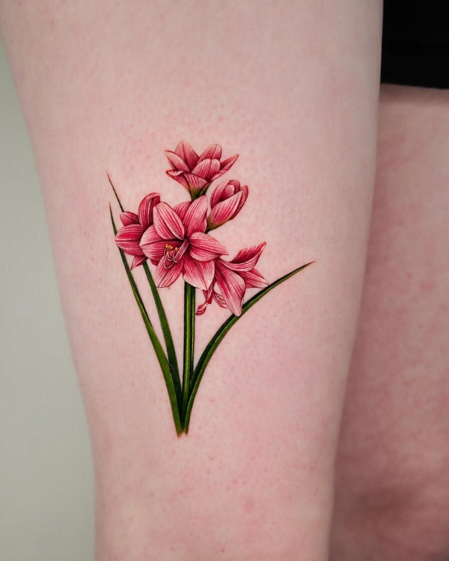 Vibrant amaryllis tattoo showcasing floral artistry