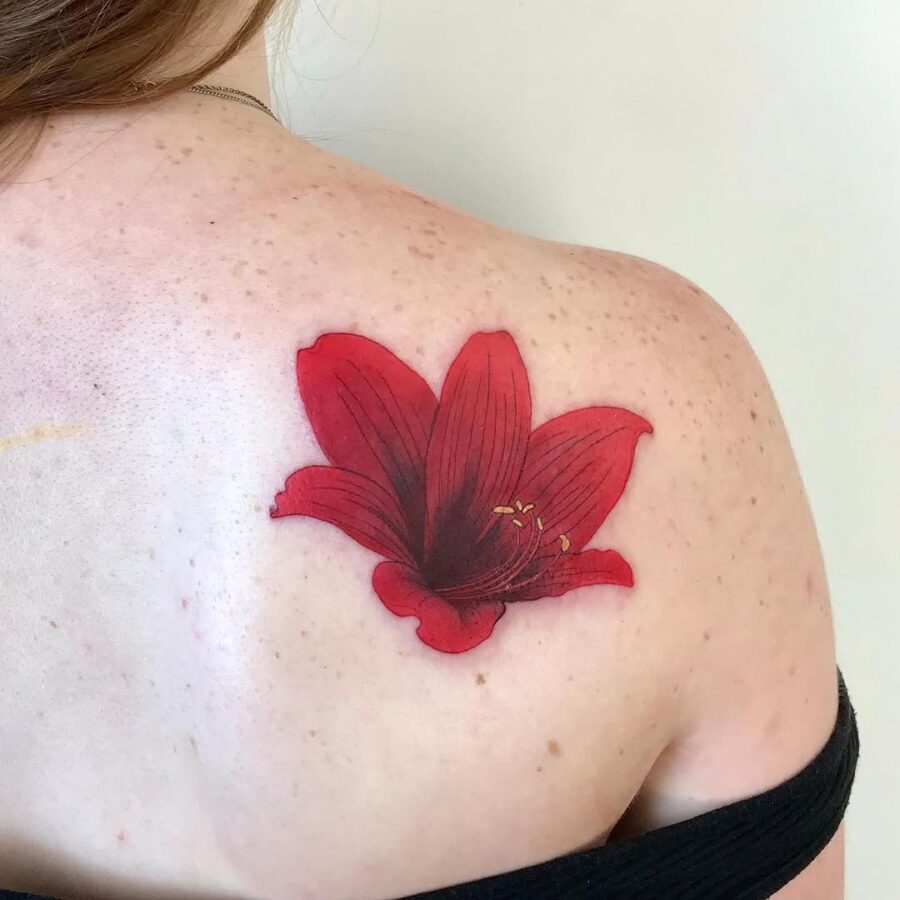 Stunning red amaryllis shoulder tattoo design
