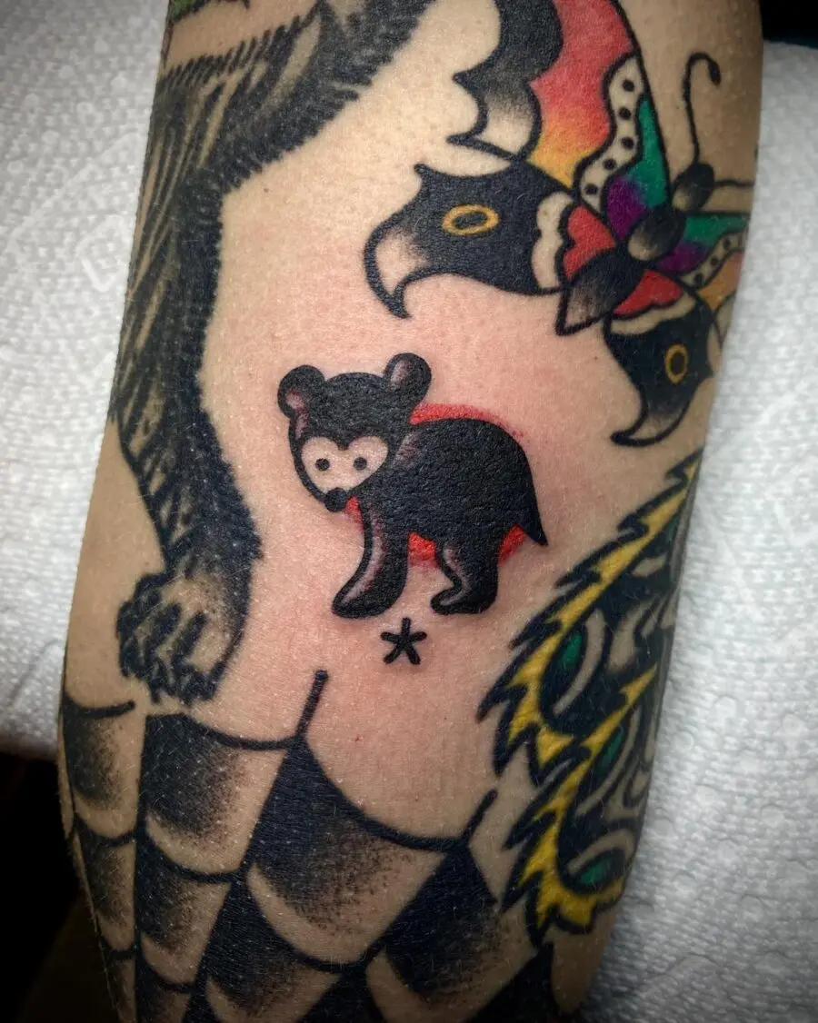 Playful bear tattoo in Americana style